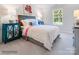 Bright bedroom with colorful decor, lots of pillows and an area rug at 1511 River Cane St, Edgemoor, SC 29712