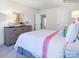 Well-lit bedroom featuring a colorful bed, dresser, and ample lighting at 1511 River Cane St, Edgemoor, SC 29712