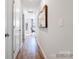 Hallway featuring wood flooring, white walls, and doors, illuminated by recessed lighting at 1511 River Cane St, Edgemoor, SC 29712