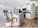 Open kitchen featuring a center island with seating, stainless steel appliances, and modern finishes at 1511 River Cane St, Edgemoor, SC 29712