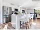 Bright kitchen with white cabinets, stainless steel appliances, and a center island with seating at 1511 River Cane St, Edgemoor, SC 29712