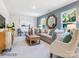 Inviting living room showcasing contemporary furniture, decor, and abundant natural light at 1511 River Cane St, Edgemoor, SC 29712
