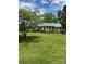 Charming single-story home with a well-maintained lawn and inviting curb appeal with mature trees and shrubs at 1512 Rutledge Ave, Charlotte, NC 28211