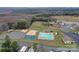 Aerial view of resort amenities including the pool, sports courts, playground, and recreational areas at 152 Eagle Dr # 27B, New London, NC 28127