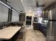 This open living and dining area includes a fireplace, lots of open space, and a well-stocked kitchen at 152 Eagle Dr # 27B, New London, NC 28127