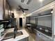This open living and dining area shows lots of open space and a well-stocked kitchen at 152 Eagle Dr # 27B, New London, NC 28127