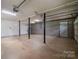 Unfinished basement with support beams and concrete floor at 1520 28Th Sw St, Hickory, NC 28602