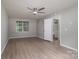 Spacious bedroom featuring a ceiling fan, neutral walls and wood flooring at 1520 28Th Sw St, Hickory, NC 28602