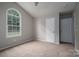 Cozy bedroom boasting neutral paint, carpet floors, and a large window for natural light at 1520 28Th Sw St, Hickory, NC 28602