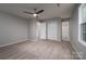 Spacious bedroom featuring plush carpet, neutral paint, ceiling fan, and ample closet space at 1520 28Th Sw St, Hickory, NC 28602