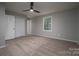 A bedroom with neutral walls, carpet flooring, and a window at 1520 28Th Sw St, Hickory, NC 28602