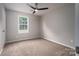 Bedroom featuring a neutral color palette, a plush carpet, and a window at 1520 28Th Sw St, Hickory, NC 28602