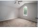 Neutral painted bedroom featuring vaulted ceilings, a ceiling fan, and a window at 1520 28Th Sw St, Hickory, NC 28602