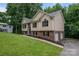 Charming exterior of home with a two-car garage, landscaping, and a lush green lawn at 1520 28Th Sw St, Hickory, NC 28602