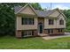 Front exterior of house with combination of brick, siding, and black trim at 1520 28Th Sw St, Hickory, NC 28602