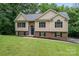 Inviting two-story home featuring a well-maintained lawn and a mix of brick and siding exterior at 1520 28Th Sw St, Hickory, NC 28602