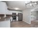 Bright kitchen with stainless steel appliances, white cabinets and new flooring at 1520 28Th Sw St, Hickory, NC 28602