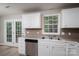 Kitchen area with stainless dishwasher and double sink at 1520 28Th Sw St, Hickory, NC 28602
