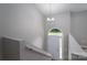 Cleanly designed stairwell leading up to a bright window and the home's front entrance at 1520 28Th Sw St, Hickory, NC 28602