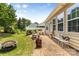 Backyard featuring a brick patio, seating, and mature landscaping at 163 Carmen Way, Lancaster, SC 29720