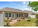 Backyard with brick patio, outdoor seating, and a well-manicured lawn at 163 Carmen Way, Lancaster, SC 29720