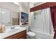 Bright bathroom featuring a shower-tub, decorative curtain, and vanity with sink at 163 Carmen Way, Lancaster, SC 29720