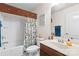 Cozy bathroom featuring a shower-tub combo with a patterned curtain and a sink with vanity at 163 Carmen Way, Lancaster, SC 29720