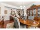 Elegant dining room with a wooden table, classic china cabinet, and a chandelier at 163 Carmen Way, Lancaster, SC 29720