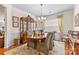 Elegant dining room with a wooden table, classic china cabinet, and a chandelier at 163 Carmen Way, Lancaster, SC 29720
