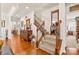 Welcoming foyer with wood floors, staircase, and decorative furnishings at 163 Carmen Way, Lancaster, SC 29720