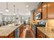 Modern kitchen with granite countertops, stainless steel appliances, and wood cabinetry at 163 Carmen Way, Lancaster, SC 29720