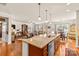 Open kitchen with a large island, granite countertops, and seamless flow to the living area at 163 Carmen Way, Lancaster, SC 29720