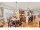 Bright kitchen featuring wooden cabinetry, stainless appliances, and adjacent dining area with hardwood flooring at 163 Carmen Way, Lancaster, SC 29720