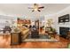Inviting living space with an open layout, fireplace, hardwood floors, and views of the kitchen and dining area at 163 Carmen Way, Lancaster, SC 29720