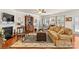 Spacious living room featuring hardwood floors, a fireplace, a decorative area rug, and comfortable seating at 163 Carmen Way, Lancaster, SC 29720
