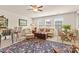 Cozy living room with a patterned rug, ample seating, and natural light from the windows at 163 Carmen Way, Lancaster, SC 29720