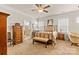 Comfortable main bedroom featuring a large bed, carpeted flooring, and an en-suite bathroom at 163 Carmen Way, Lancaster, SC 29720