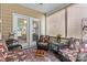 Sunroom with comfortable seating, neutral colors, and natural lighting at 163 Carmen Way, Lancaster, SC 29720