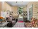 Comfortable sunroom featuring wicker seating and an outdoor view at 163 Carmen Way, Lancaster, SC 29720