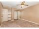 Bedroom with neutral carpet, ceiling fan, and closet with sliding mirror doors at 1638 Hunters Trl, Rock Hill, SC 29732