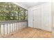 Enclosed wooden deck or porch offering an outdoor space with a view of the surrounding trees at 1638 Hunters Trl, Rock Hill, SC 29732