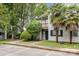 Two-story home with grey siding, a balcony, dark shutters, and mature landscaping at 1638 Hunters Trl, Rock Hill, SC 29732