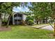 Townhouse-style home with a tidy lawn, landscaping, and gray wood facade at 1638 Hunters Trl, Rock Hill, SC 29732