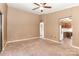 Neutral living room with carpet, ceiling fan, and openings to other rooms at 1638 Hunters Trl, Rock Hill, SC 29732