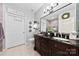 Beautiful bathroom with double sink vanity, granite countertop, decorative mirror, and stylish decor at 1644 Backcreek Ln, Gastonia, NC 28054