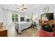 Cozy bedroom with light wood floors, a ceiling fan, and lots of natural light at 1644 Backcreek Ln, Gastonia, NC 28054