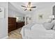 Bedroom with light wood floors, ceiling fan, dresser and ensuite at 1644 Backcreek Ln, Gastonia, NC 28054