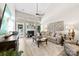 Bright living room with a fireplace, comfortable seating, and a back door leading to the patio and yard at 1644 Backcreek Ln, Gastonia, NC 28054