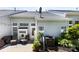 Charming outdoor patio featuring comfortable seating, lush plants, and a well-maintained exterior at 1644 Backcreek Ln, Gastonia, NC 28054