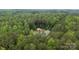 High aerial view of the property, nestled among lush trees, showcasing its private location and features at 213 Genesis Pl, Cleveland, NC 27013